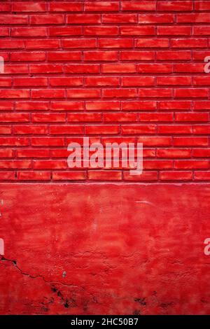 Vertical shot of a painted red brick wall Stock Photo