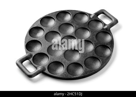 Traditional single black poffertjes cast iron baking pan isolated on white background Stock Photo