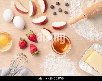 Top view of ingredients on a wooden table for baking a pie Stock Photo