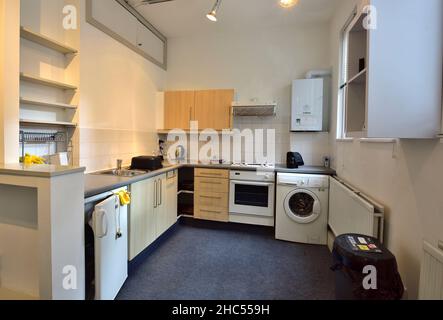 Kitchen room with appliances in empty flat prepared for renting, Bristol, UK Stock Photo
