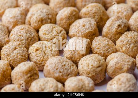 Raw Soya chunks closeup photo. These are the byproducts left after extracting soybean oil. It is a good source of protein and used in Indian cuisine. Stock Photo