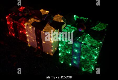 Set of Christmas Gift Boxes Light Up the Night Stock Photo