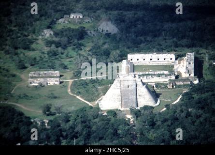 Uxmal Yucatan Mexico. 12/27/1985. Aerial view Uxmal ruins.  Occupation estimated population about 15,000 people at Uxmal’s peak.  Uxmal: capital of a Late Classic Maya circa 850-925 AD. Most building ceased by 1100 AD.  Maya chronicles suggest Uxmal was founded about 500 A.D. by and ruled-by the Hun Uitzil Chac Tutul Xiu family. Stock Photo