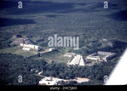 Uxmal Yucatan Mexico. 12/27/1985. Aerial view Uxmal ruins.  Occupation estimated population about 15,000 people at Uxmal’s peak.  Uxmal: capital of a Late Classic Maya circa 850-925 AD. Most building ceased by 1100 AD.  Maya chronicles suggest Uxmal was founded about 500 A.D. by and ruled-by the Hun Uitzil Chac Tutul Xiu family. Stock Photo