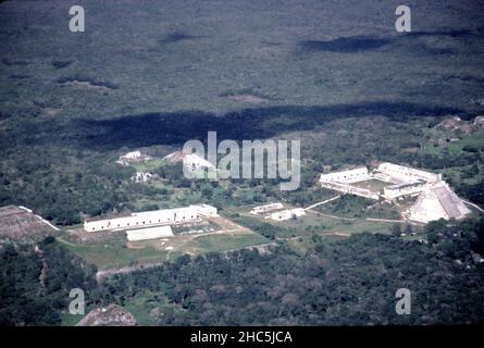 Uxmal Yucatan Mexico. 12/27/1985. Aerial view Uxmal ruins.  Occupation estimated population about 15,000 people at Uxmal’s peak.  Uxmal: capital of a Late Classic Maya circa 850-925 AD. Most building ceased by 1100 AD.  Maya chronicles suggest Uxmal was founded about 500 A.D. by and ruled-by the Hun Uitzil Chac Tutul Xiu family. Stock Photo