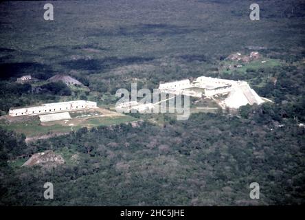 Uxmal Yucatan Mexico. 12/27/1985. Aerial view Uxmal ruins.  Occupation estimated population about 15,000 people at Uxmal’s peak.  Uxmal: capital of a Late Classic Maya circa 850-925 AD. Most building ceased by 1100 AD.  Maya chronicles suggest Uxmal was founded about 500 A.D. by and ruled-by the Hun Uitzil Chac Tutul Xiu family. Stock Photo