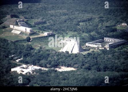 Uxmal Yucatan Mexico. 12/27/1985. Aerial view Uxmal ruins.  Occupation estimated population about 15,000 people at Uxmal’s peak.  Uxmal: capital of a Late Classic Maya circa 850-925 AD. Most building ceased by 1100 AD.  Maya chronicles suggest Uxmal was founded about 500 A.D. by and ruled-by the Hun Uitzil Chac Tutul Xiu family. Stock Photo