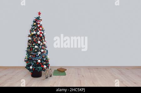christmas tree on hardwood floor Stock Photo
