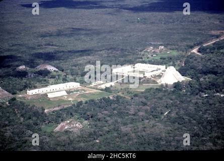 Uxmal Yucatan Mexico. 12/27/1985. Aerial view Uxmal ruins.  Occupation estimated population about 15,000 people at Uxmal’s peak.  Uxmal: capital of a Late Classic Maya circa 850-925 AD. Most building ceased by 1100 AD.  Maya chronicles suggest Uxmal was founded about 500 A.D. by and ruled-by the Hun Uitzil Chac Tutul Xiu family. Stock Photo