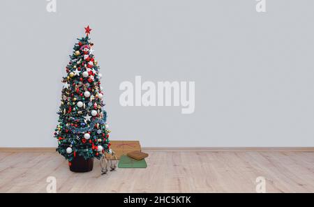 christmas tree on hardwood floor Stock Photo