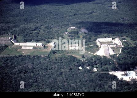 Uxmal Yucatan Mexico. 12/27/1985. Aerial Uxmal ruins.  Occupation estimated population about 15,000 people at Uxmal’s peak.  Uxmal: capital of a Late Classic Maya circa 850-925 AD. Most building ceased by 1100 AD.  Maya chronicles suggest Uxmal was founded about 500 A.D. by and ruled-by the Hun Uitzil Chac Tutul Xiu family. Stock Photo