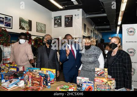 New York, USA. 24th Dec, 2021. Lieutenant Governor Brian Benjamin (3rd from left) participates in toys distribution with Reverend Al Sharpton (2nd from left) and Manhattan Borough President Gale Brewer (1st from right) at National Action Network headquarters on Christmas Eve in New York on December 24, 2021. (Photo by Lev Radin/Sipa USA) Credit: Sipa USA/Alamy Live News Stock Photo