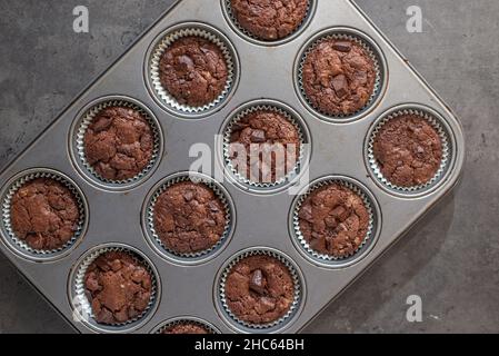 sweet home made chocolate brownie muffins on a table Stock Photo