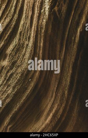 Vertical shot of a textured sandstone wall Stock Photo