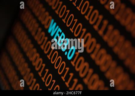 Close up of Binary codes on screen and WEB3.0 word in the middle - New Decentralized Internet - Smart Contract and Digital Ownership Stock Photo