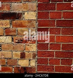 Close up of a heritage wall with old vintage bricks next to new bricks Stock Photo