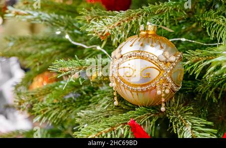 Christmas background - baubles and branch of spruce tree Stock Photo