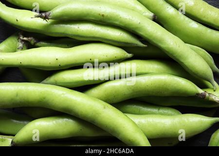 Photography of a bunch of broad beans in pods for food background Stock Photo