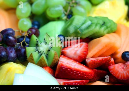 A mix of multiple types of colorful fruits, including strawberry and kiwi. Stock Photo