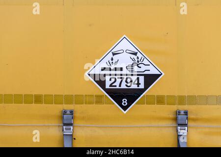 Dangerous goods sign for batteries filled with acid Stock Photo