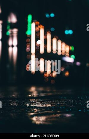 Vertical shot of blurred lights in the street Stock Photo