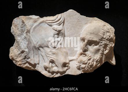 Marble relief of a man with horse, fragment of an attic funerary stele, 4th century BC. Stock Photo