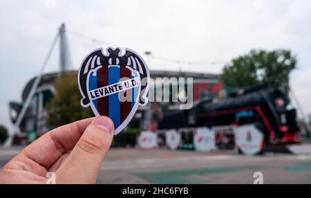 August 30, 2021, Valencia, Spain. The emblem of the football club Levante UD against the background of a modern stadium. Stock Photo