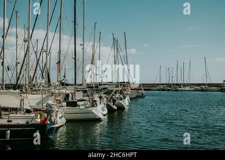 View to bay with sea water and moored boats, yachts. Amazing azure nature background. Anchoring in private beach on tropical island, travel Stock Photo