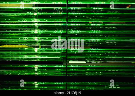 A lot of green pipes. Data center, server room. Concept of modern technology, big data storage. Abstract background. Stock Photo