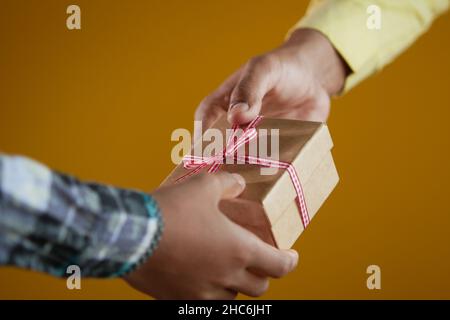 men hand giving homemade gift box  Stock Photo