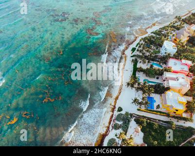 Aerial Picture of luxury colorful real estates in the Akumal Bay in Quintana Roo, Mexico during Sunset Stock Photo