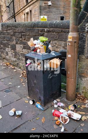 Edinburgh, Scotland- Nov 21, 2021:  An overflowing rubbish bin on the streets of Edinburgh Scotland. Stock Photo