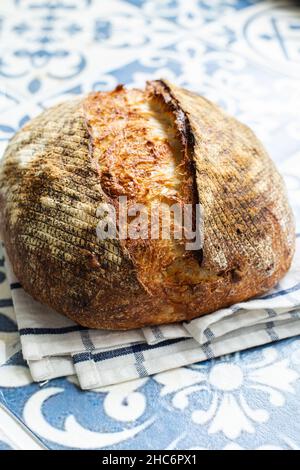Freshly backed sliced cheesy sourdough bread. Top view. Stock Photo
