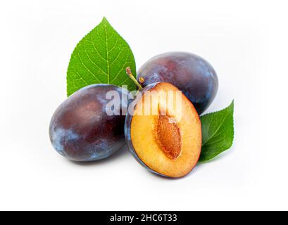 fresh plum fruits with green leaf isolated on white background Stock Photo