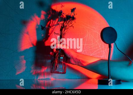 Sunset projector lamp on the table. Multi colored RGB light. Home decor. Stock Photo