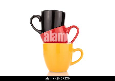 Three ceramic cups, close-up, isolated on white. Stock Photo