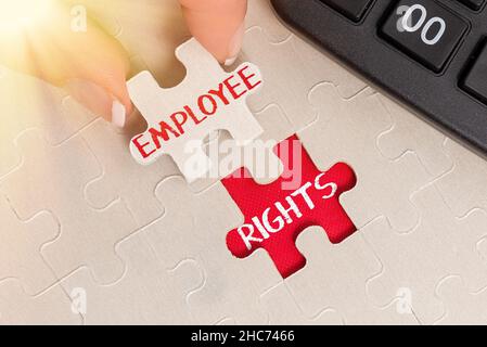 Conceptual display Employee Rights. Business concept All employees have basic rights in their own workplace Building An Unfinished White Jigsaw Stock Photo