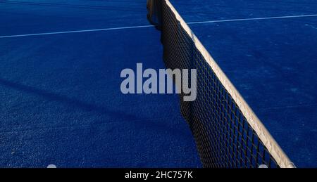 Partial view of a blue paddle tennis court Stock Photo