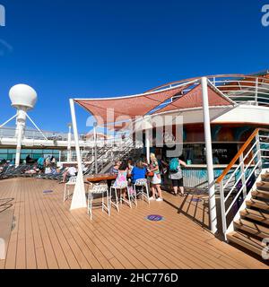 Orlando, FL USA-December 6,, 2021:  The Main Pool Bar on the Royal Caribbean RCL cruise ship Independence of the Seas in Port Canaveral, Florida. Stock Photo