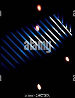Vertical shot of blue lines on a dark background Stock Photo