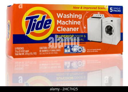 Winneconne, WI -21 December 2021: A package of Tide washing machine cleaner on an isolated background Stock Photo