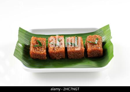 Wajik, Sweet Sticky Rice Cake is Commonly Found in Indonesia, Malaysia, and Brunei. Glutinous Rice Cooked in Palm Sugar and Coconut Milk. Isolated on Stock Photo