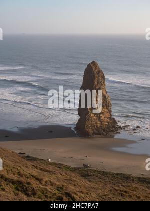 Sea stack at the edge of the Pacific Ocean at Blanco State Park in Oregon. Photographed at the golden hour. Stock Photo