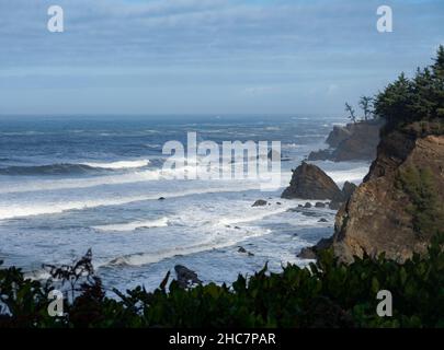 View overlooking the rocky cliffs and surf at Cape Arago on the Oregon Coast. Stock Photo