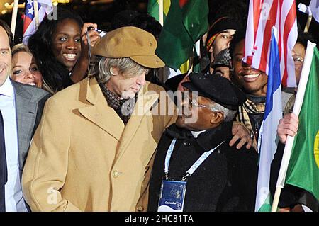 File photo dated 08/02/10 of Sir Bob Geldof (left) and Archbishop Desmond Tutu joining delegates from around the world at the One Young World Summit ceremony at Old Billingsgate, London. Desmond Tutu, the Nobel Peace Prize-winning activist for racial justice and LGBT rights, has died aged 90. He had been treated in hospital several times since 2015, after being diagnosed with prostate cancer in 1997. Issue date: Sunday December 26, 2021. Stock Photo