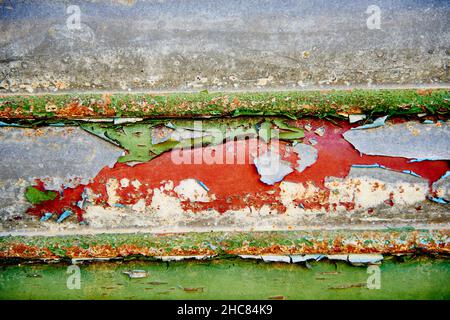 Detail of the old shutter with peeling paint of different colors Stock Photo