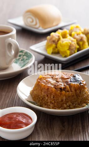 Dim Sum Loh Mai Kai Steamed Glutinous Rice with chicken mushrooms and sausage Stock Photo