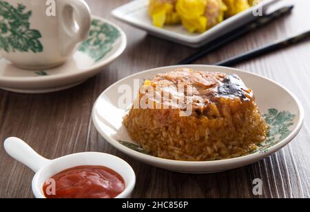 Dim Sum Loh Mai Kai Steamed Glutinous Rice with chicken mushrooms and sausage Stock Photo