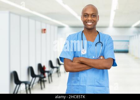 Laughing mature adult african american male nurse at vaccination station for vacinating patients against coronavirus infection Stock Photo