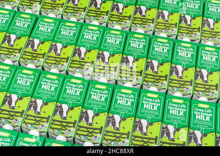 1 Litre paper carton units of ASDA own-label long-life UHT semi-skimmed milk. For British food produce, UK dairy industry, supply chain crisis UK. Stock Photo